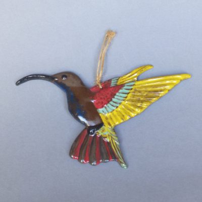 Miniature d'un colibri jaune et rouge