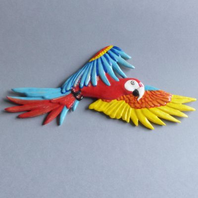 Miniature de ara rouge en vol